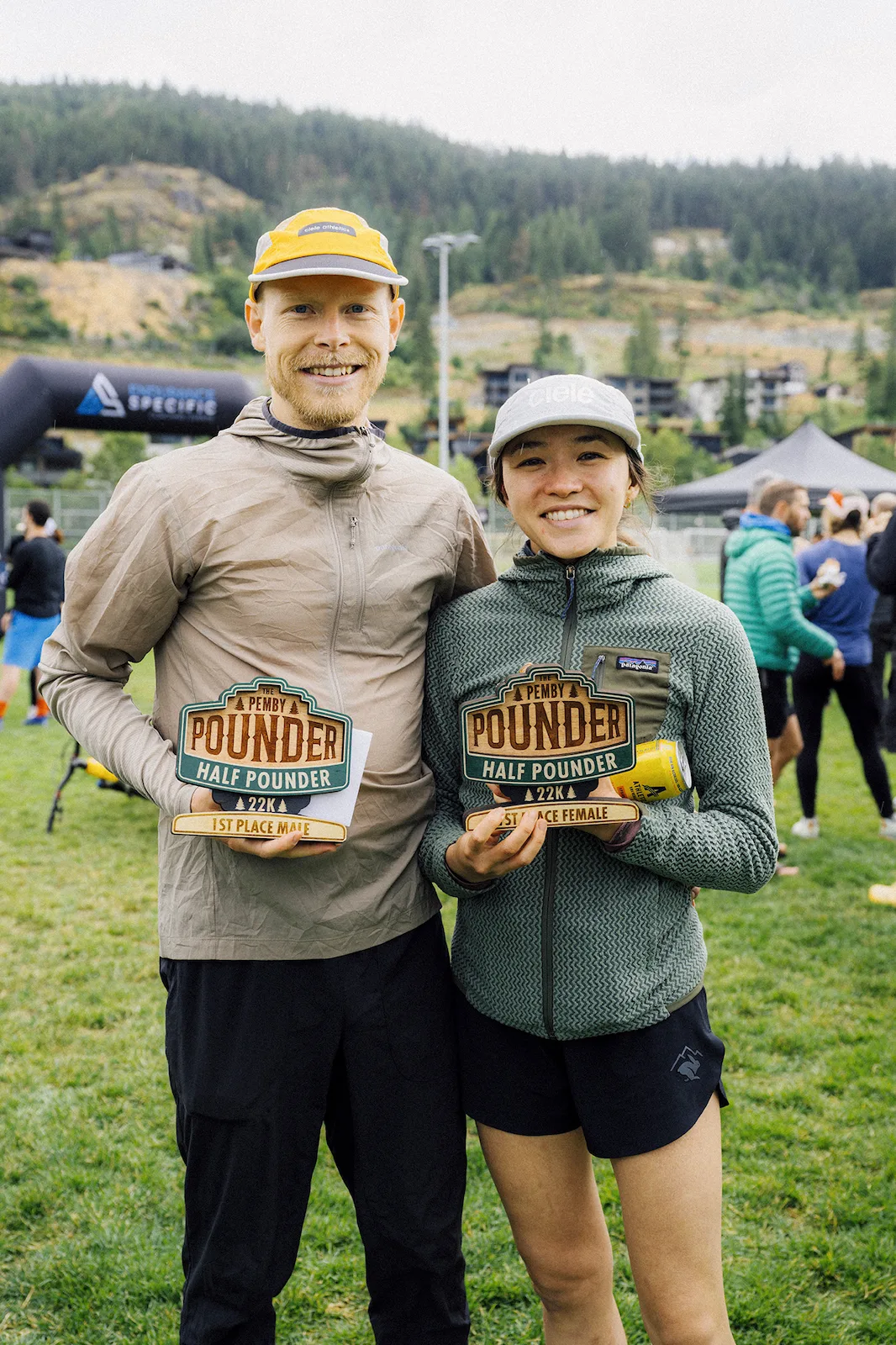 Athlete at the summit ridge with valley views